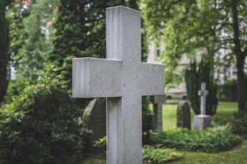 Stone cross gravestones on cemetery - graveyard