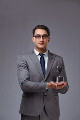 Businessman holding star award in business concept