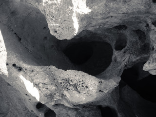 Macro closeup on surface of the rock stone dark background