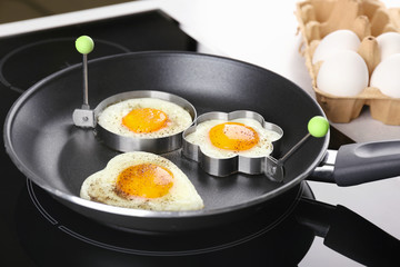 Cooking of sunny side up fried eggs in frying pan