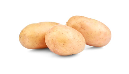 Raw unpeeled potatoes on white background