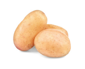 Raw unpeeled potatoes on white background