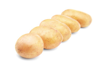 Raw unpeeled potatoes on white background