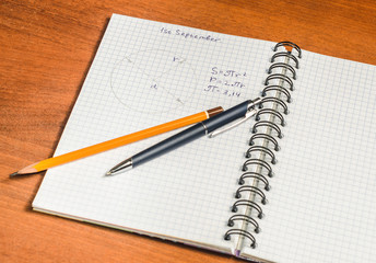 School notebook, formulas, pen, pencil