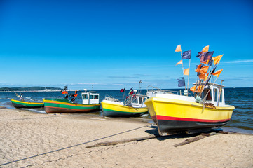 Naklejka na ściany i meble fishing boat at the Baltic beach