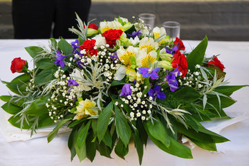 Beautiful bouquet of fresh tropical flowers on festive table
