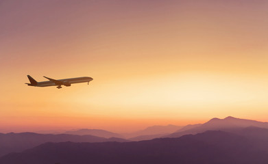 Naklejka premium travel concept background, airplane in sunset sky, international flight