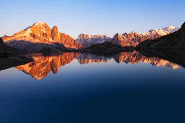 Foto op Canvas beautiful mountains skyline landscape at sunset, panoramic view of Alps with reflection in lake, nature background with copyspace © Song_about_summer