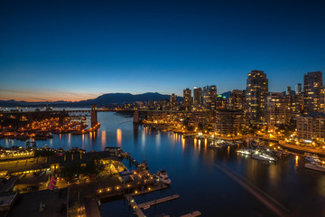 Burrard Bridge and Downtown Vancouver at sunset.