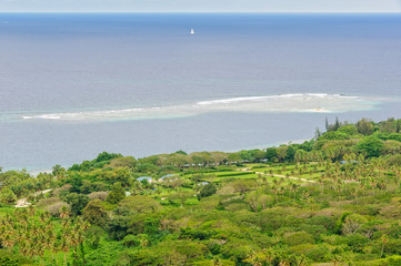 A yacht in the Mele Bay spotted from The Summit Gardens - Port Vila, Efate Island, Vanuatu