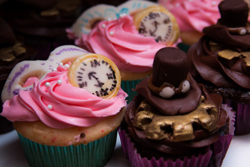 Cupcakes with clocks and hats