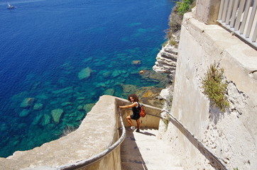 Descending the stairs carved in the cliffs of Bonifacio