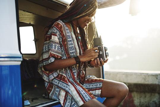 Woman Sitting with Camera Taking Snap Shoot Photo in a  Van