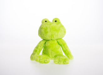 toy or frog soft toy on the background.