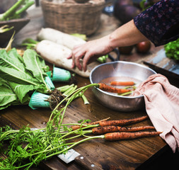 Closeup of fresh carrots in water bowl
