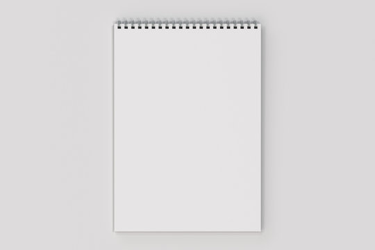Blank white notebook with metal spiral bound on white background