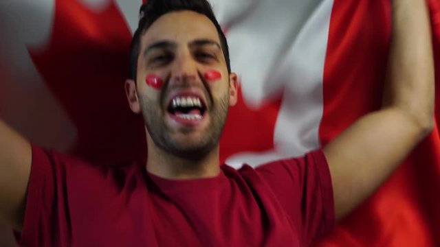 Canadian Guy Celebrating with Canada Flag