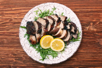 Roast fillet leg of lamb with greens and lemon