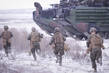 Soldiers from US Navy Amphibious Squadron 8 assault an enemy strong point during a NATO military...