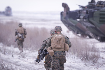 Soldiers from US Navy Amphibious Squadron 8 assault an enemy strong point during a NATO military exercise