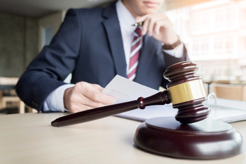 gavel and sound block of justice law and lawyer working on wooden desk background