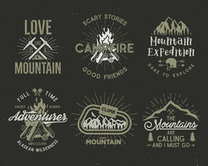 Fototapeta premium Set of mountain and scouting badges. Climbing labels, mountains expedition emblems, vintage hiking silhouettes logos and design elements. retro letterpress style isolated