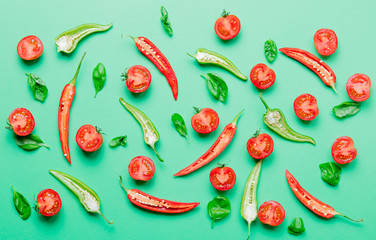 cutted Chili pepper and basil with tomatoes
