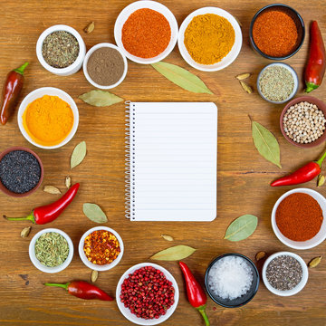 Variety of spices and herbs for cooking meat, fish, chicken, vegetable and blank notebook