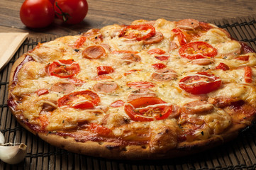 Delicious fresh pizza served on wooden table