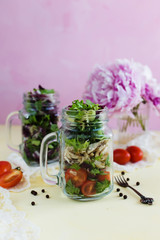 Salad with chicken and herbs in a mug