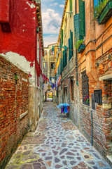 Fototapeta premium Colorful street in the Italian Venice.