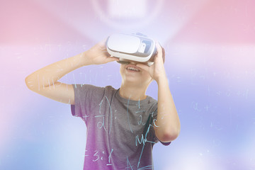 Boy with virtual reality glasses on color background. Concept of school and modern technology