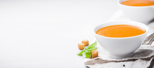Obraz na płótnie Canvas Homemade tomato soup (or gazpacho) over concrete background