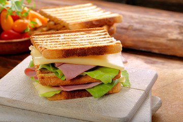 Fresh sandwiches on wooden background