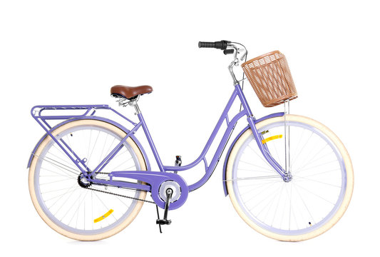 Fototapeta Modern bicycle with basket on white background
