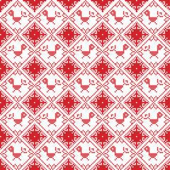 Scandinavian seamless cross stitch inspired by Nordic style Christmas pattern in cross stitch with bird Robin , star and decorative ornaments in red and white in square shape
