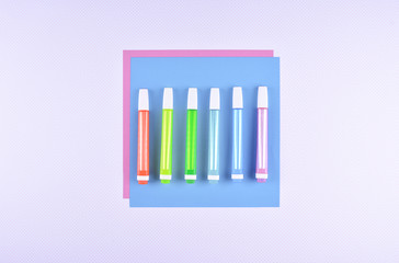 Workplace. Sheet of colored paper and highlighters.