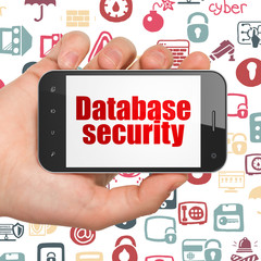 Privacy concept: Hand Holding Smartphone with Database Security on display