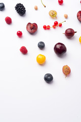 Naklejka na ściany i meble Mix of berries isolated over white background table.