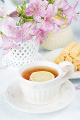 Tea with lemon and waffles