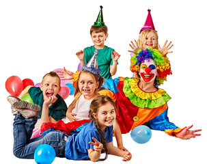 Obraz na płótnie Canvas Birthday child clown playing with children and bunny fingers prank. Kid holiday cakes celebratory and balloons happiest day. Children at a children's matinee. Holiday for kids in kindergarten.