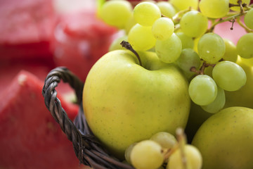 Summer Still Life fruit freshness from ripe grapes, apple and watermelon