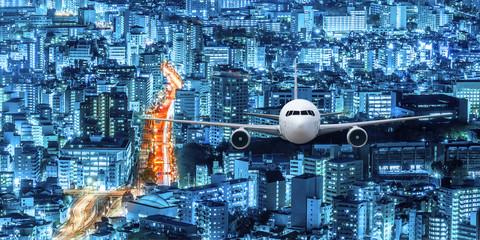 Airplane flying over the city at night