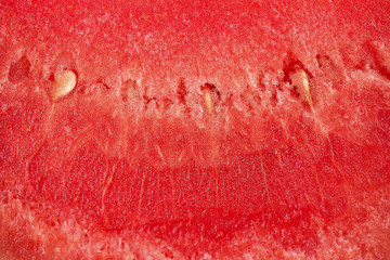 Background texture of a juicy, ripe pulp of red watermelon