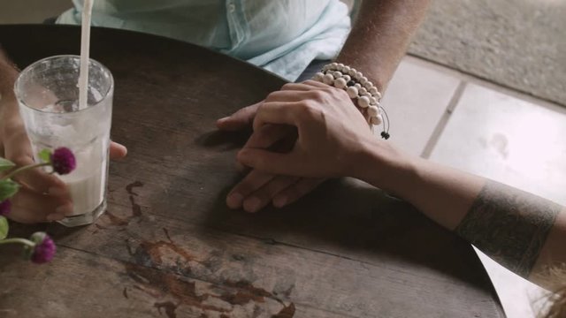 Close-up of lovers hands holding each other
