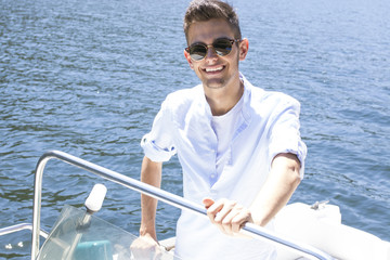 young man on the yacht's summer vacation