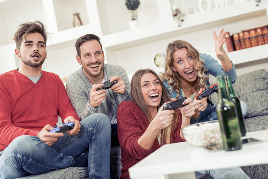 Group of friends playing video games together.