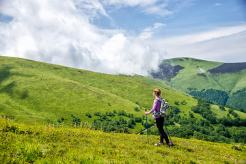 Fototapeta na wymiar Young woman hiking in the mountains