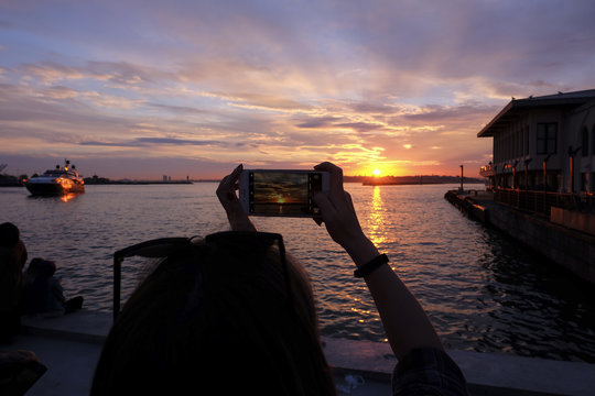 Tourist is Taking Sunset Photo with Smart Phone at The Istanbul