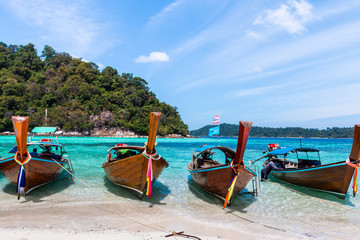 Fototapeta na wymiar Tropical beach, traditional long tail boats, Andaman Sea, Thailand.